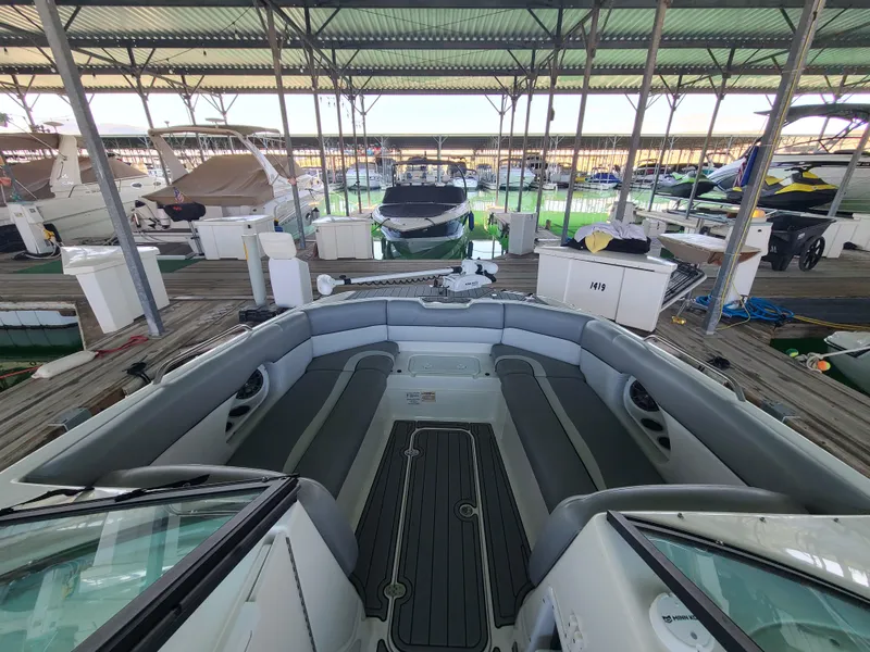Slide: The Image of 2021 NauticStar 243 DC boat interior at marina dock. - 9