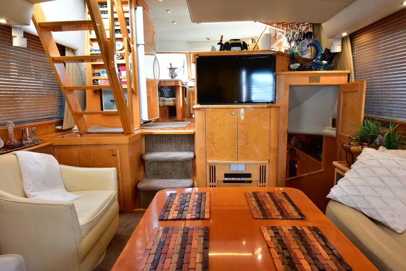 Slide: The Image of Luxurious 2004 Navigator Rival yacht interior with wood finishes and modern amenities. - 15