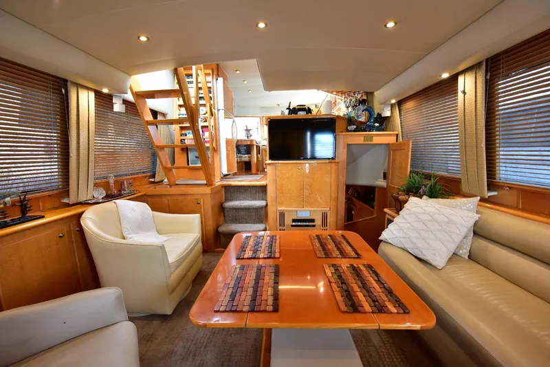 Slide: The Image of Luxurious 2004 Navigator Rival yacht interior with elegant seating and dining area. - 17