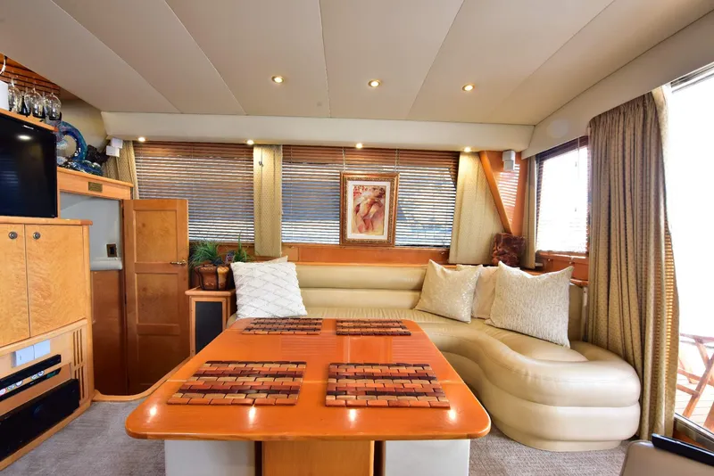 Slide: The Image of Luxurious 2004 Navigator Rival yacht interior with elegant seating and wooden accents. - 18