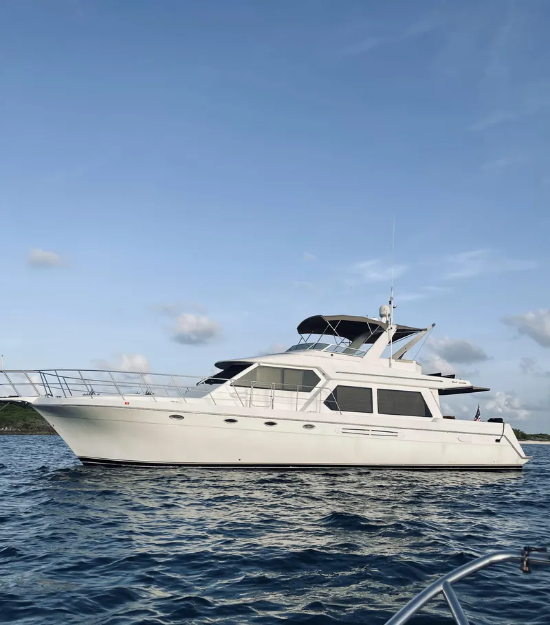 Slide: The Image of 2004 Navigator Rival yacht on calm sea under clear sky. - 2