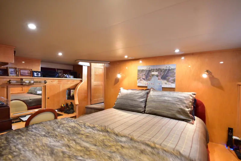 Slide: The Image of Luxurious bedroom interior of 2004 Navigator Rival yacht with cozy lighting and elegant decor. - 25