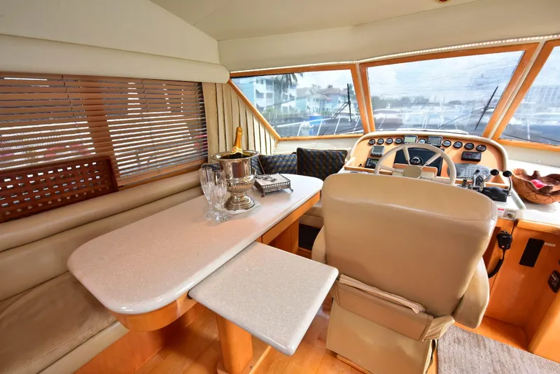 Slide: The Image of Luxurious 2004 Navigator Rival yacht interior with helm, dining area, and elegant decor. - 37