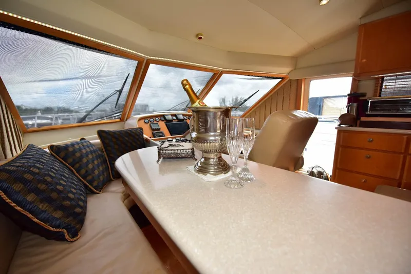 Slide: The Image of Luxurious 2004 Navigator Rival yacht interior with champagne and glasses on table. - 38