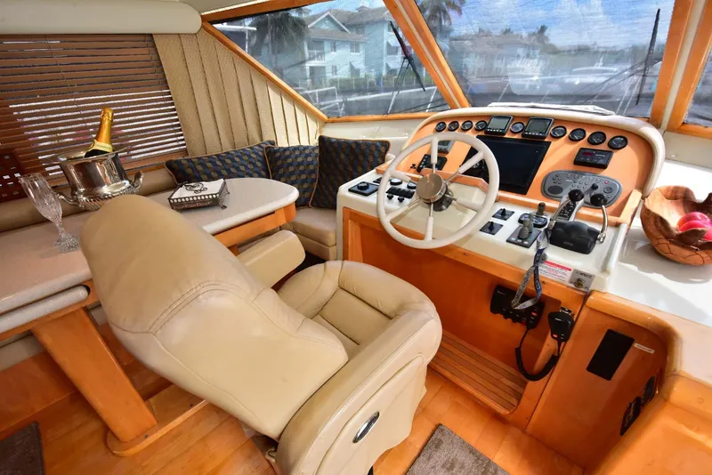 Slide: The Image of Luxurious 2004 Navigator Rival yacht interior with leather seating and elegant control panel. - 39