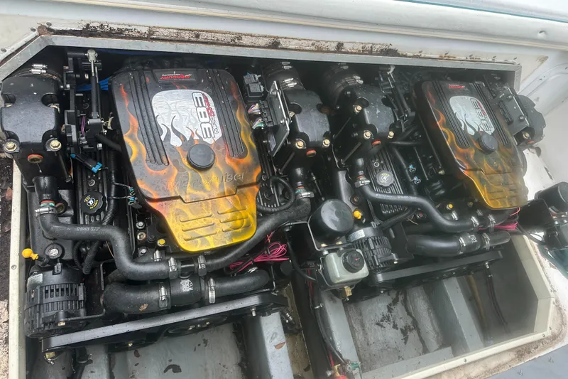 Slide: The Image of Twin engines of a 1996 Sport-Craft 272 Sportfish boat, detailed view. - 6