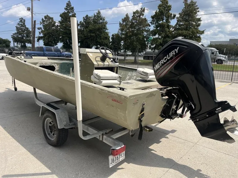 Slide: The Image of Nova 20 boat from 2000 with Mercury outboard motor on trailer. - 14