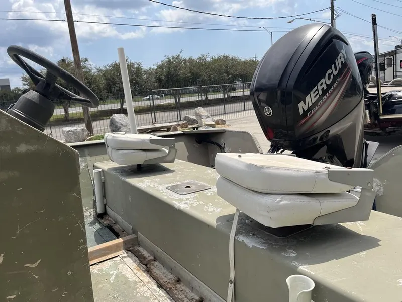 Slide: The Image of Nova 20 boat with Mercury outboard motor, 2000 model, featuring dual seats and steering wheel. - 15