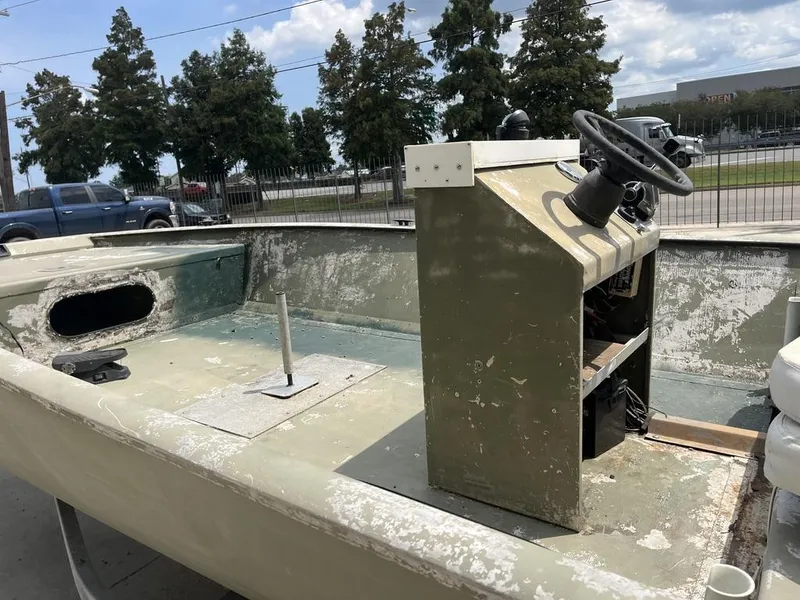 Slide: The Image of Old Nova 20 boat interior with worn steering console, 2000 model. - 7