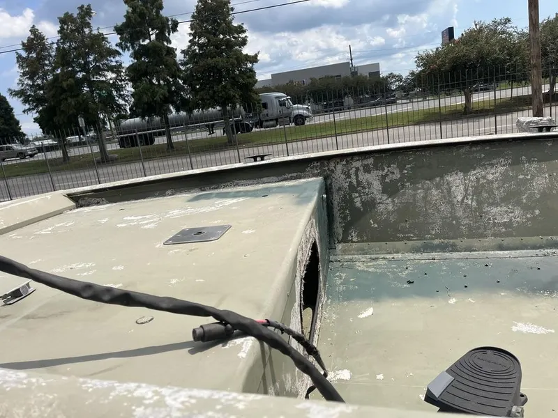 Slide: The Image of Worn Nova 20 boat interior, 2000 model, with peeling paint and visible wiring. - 9