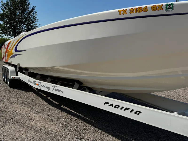 Slide: The Image of 2002 Cigarette 36 Gladiator boat on trailer, side view with registration number. - 4