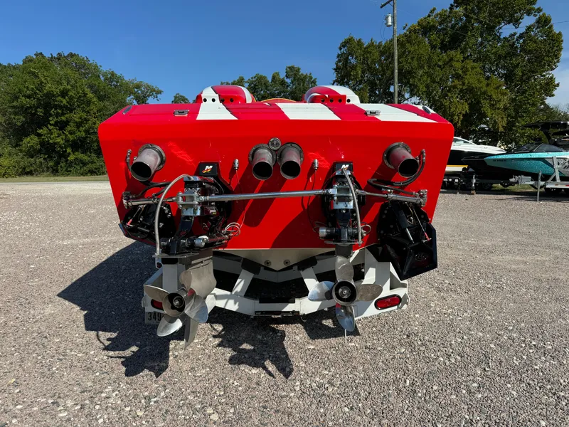 Slide: The Image of Rear view of a 2002 Cigarette 36 Gladiator speedboat with red and white design. - 7