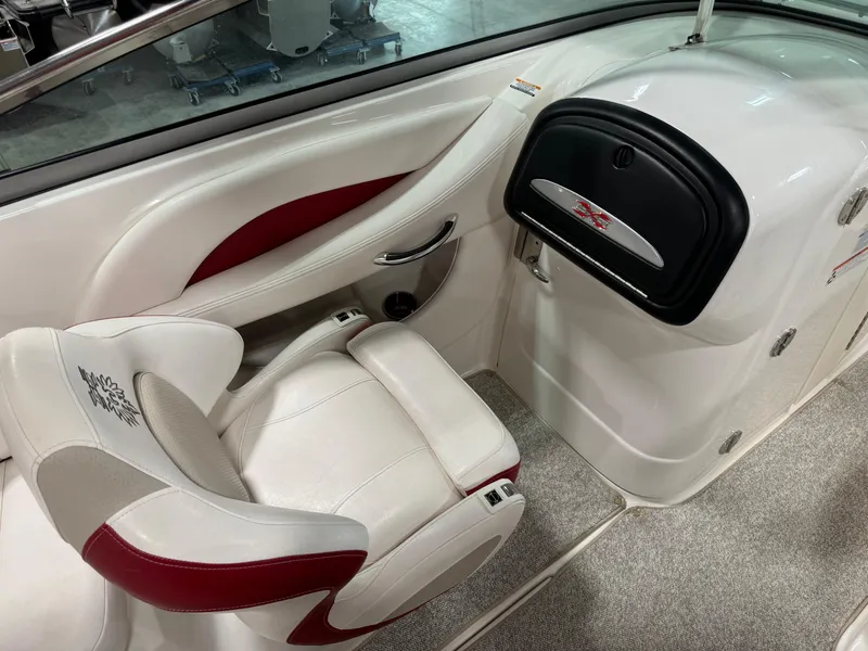 Slide: The Image of 2011 Chaparral 267 SSX boat interior with white and red seating. - 10
