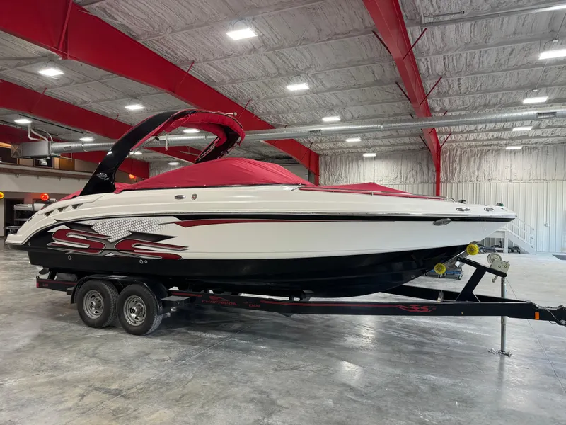 Slide: The Image of 2011 Chaparral 267 SSX boat on trailer in indoor storage facility. - 14