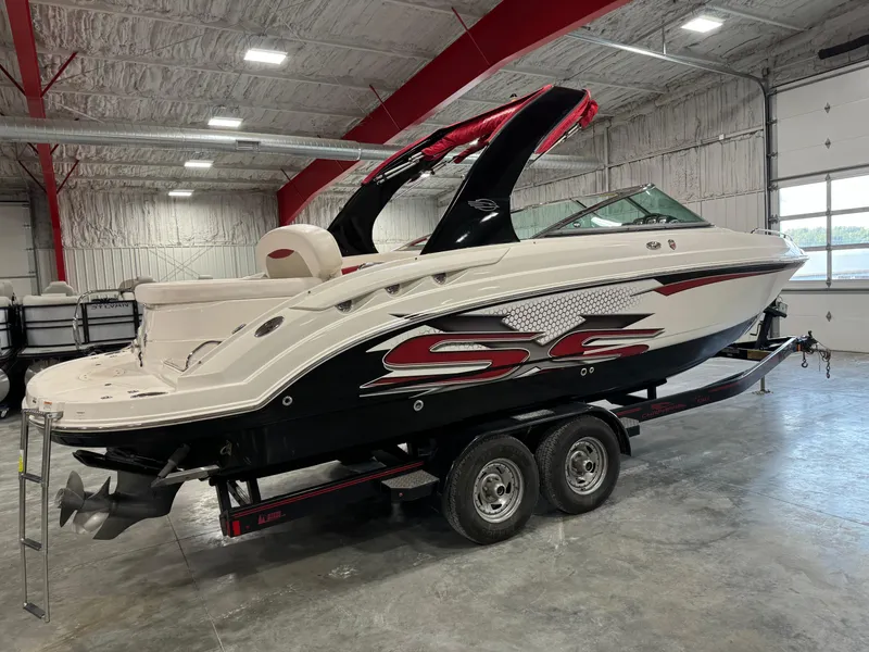 Slide: The Image of 2011 Chaparral 267 SSX boat on trailer in indoor storage facility. - 3