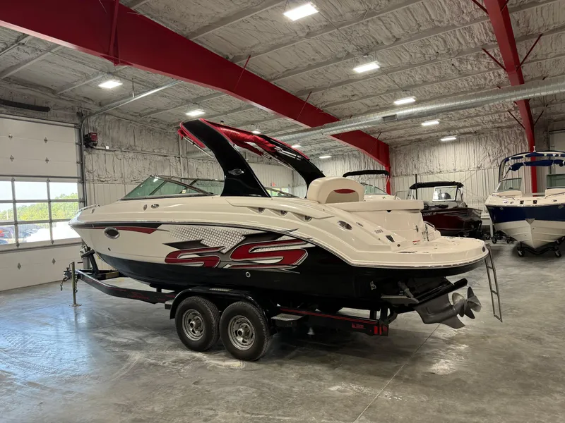 Slide: The Image of 2011 Chaparral 267 SSX boat in a spacious indoor showroom. - 4
