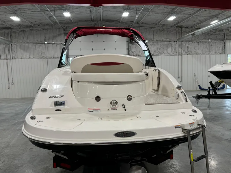 Slide: The Image of 2011 Chaparral 267 SSX boat in a spacious indoor storage facility. - 5
