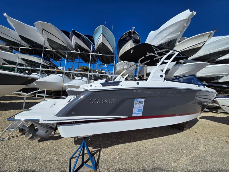 The Image of 2025 Cobalt R8 boat displayed in a marina with multiple boats in the background. - 0