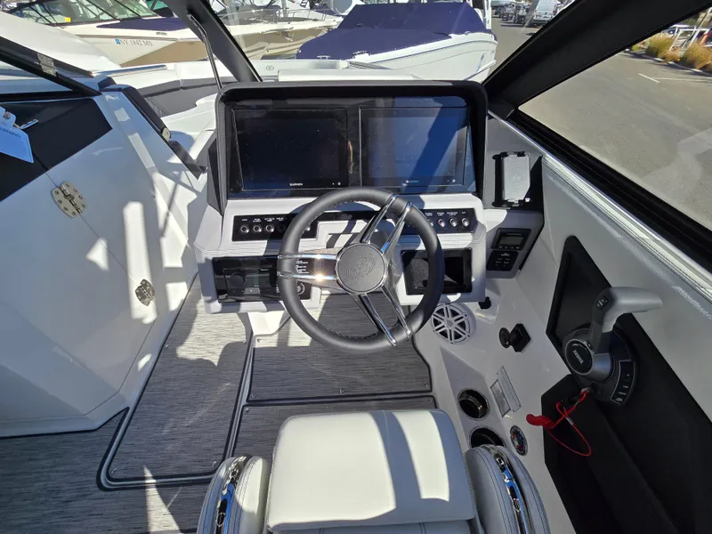 Slide: The Image of 2025 Cobalt R8 boat cockpit with modern steering and navigation displays. - 10