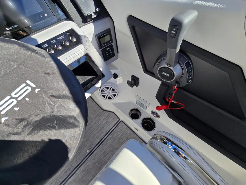 Slide: The Image of Interior of 2025 Cobalt R8 boat with steering wheel and control panel. - 11