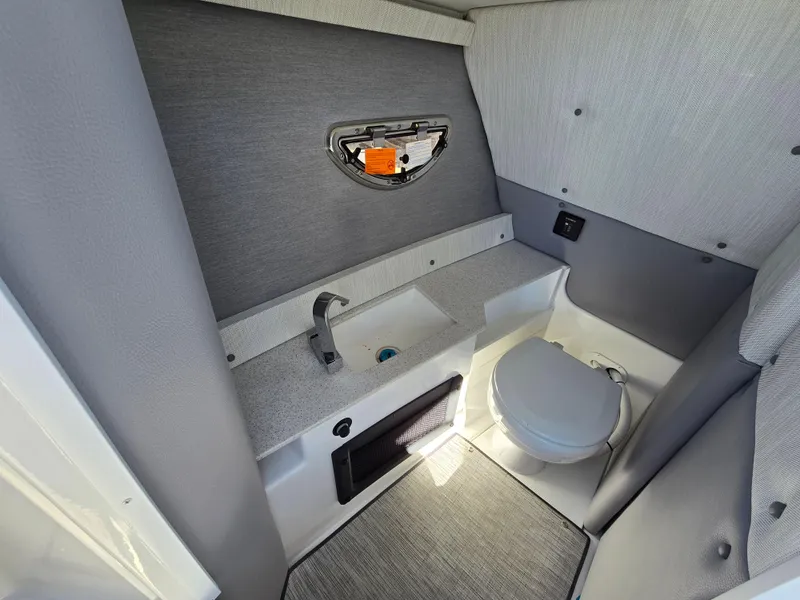 Slide: The Image of 2025 Cobalt R8 boat interior bathroom with sink and toilet. - 15