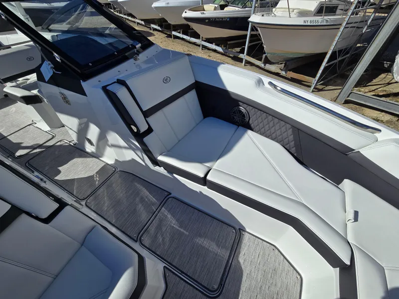 Slide: The Image of 2025 Cobalt R8 boat interior with sleek white seating and modern design. - 18