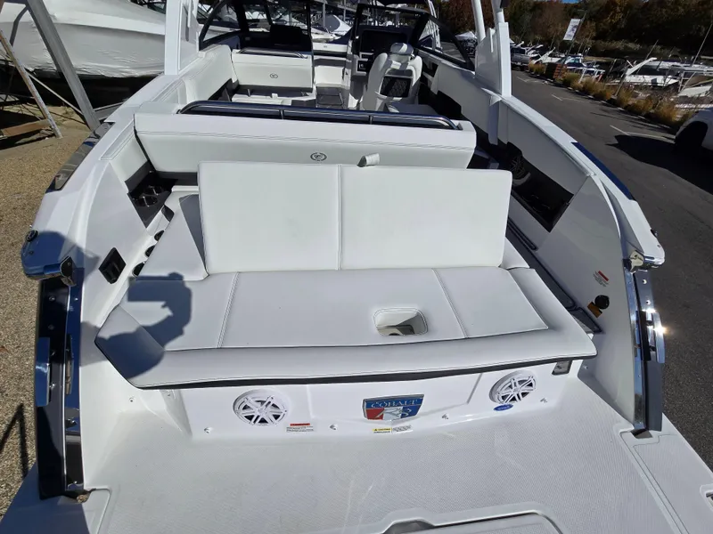 Slide: The Image of 2025 Cobalt R8 boat interior with white seating and built-in speakers. - 3
