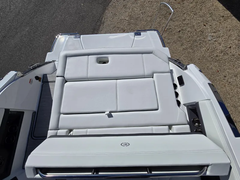 Slide: The Image of 2025 Cobalt R8 boat with white cushioned seating, top view. - 4