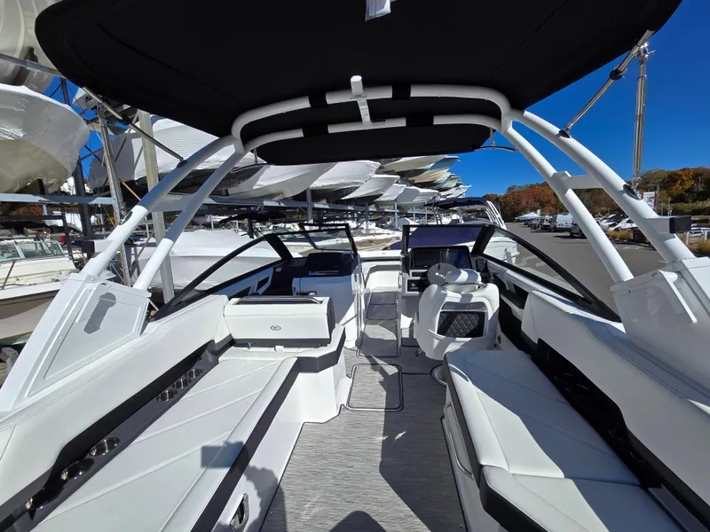 Slide: The Image of 2025 Cobalt R8 boat interior with sleek white seating and modern design. - 5