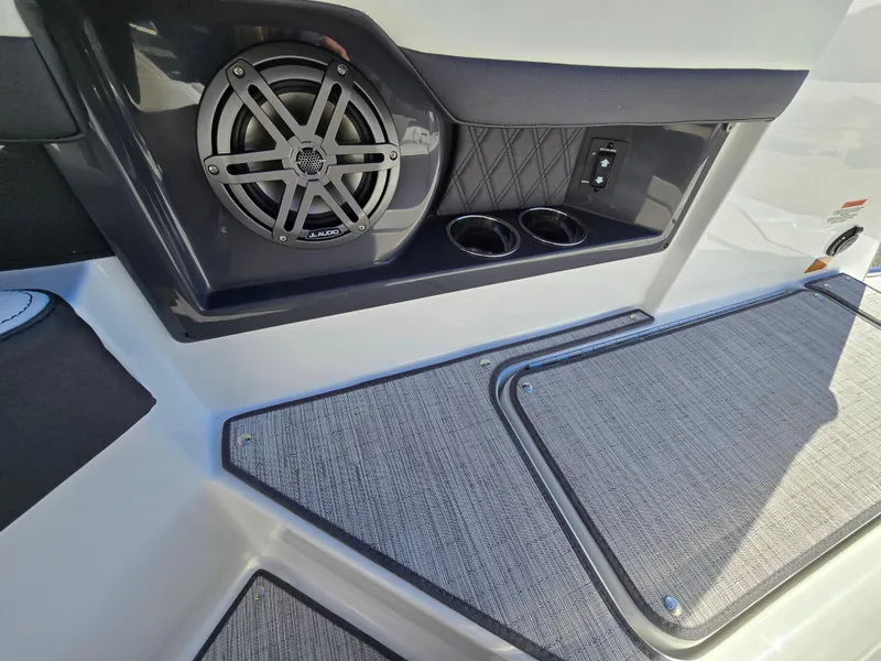 Slide: The Image of 2025 Cobalt R8 boat interior with speaker and cup holders. - 8