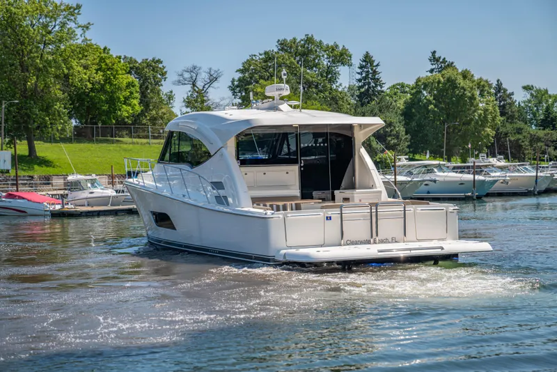 Slide: The Image of 2020 Riviera 525 SUV cruising on a sunny day in a marina. - 11