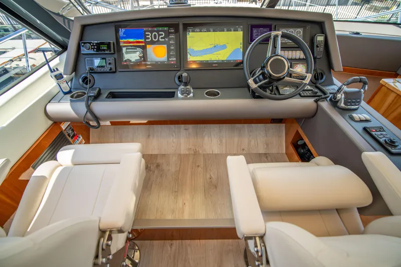 Slide: The Image of Luxurious 2020 Riviera 525 SUV helm with advanced navigation displays and plush seating. - 19