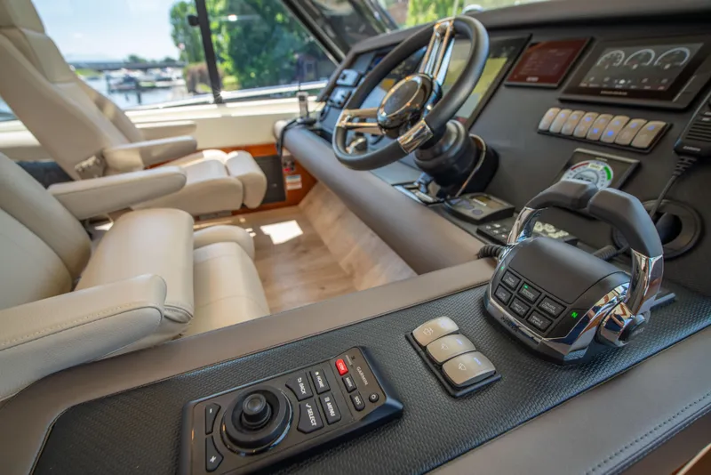 Slide: The Image of Luxurious 2020 Riviera 525 SUV yacht cockpit with advanced controls and plush seating. - 22