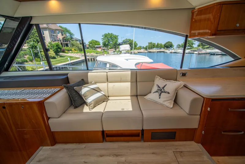 Slide: The Image of Luxurious interior of 2020 Riviera 525 SUV yacht with waterfront view. - 28