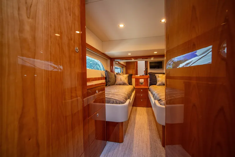 Slide: The Image of Luxurious 2020 Riviera 525 SUV cabin interior with twin beds and wooden finish. - 34