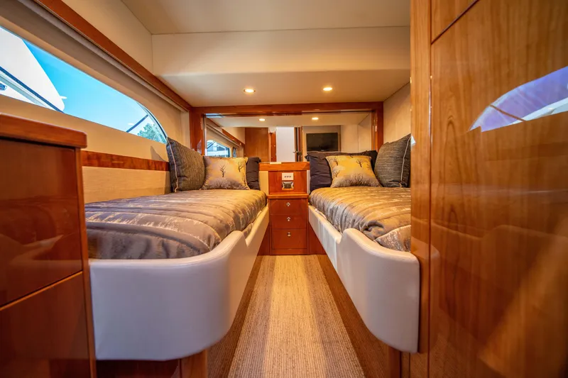 Slide: The Image of Luxurious interior of 2020 Riviera 525 SUV with twin beds and elegant wood finish. - 35