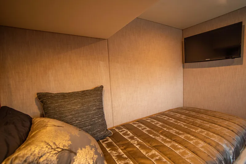 Slide: The Image of Cozy interior of 2020 Riviera 525 SUV with bed and wall-mounted TV. - 37