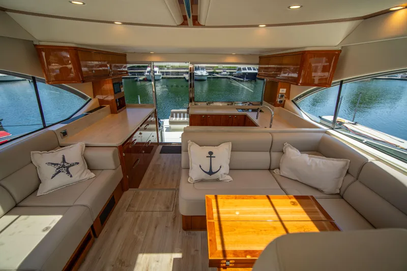 Slide: The Image of Luxurious interior of 2020 Riviera 525 SUV yacht with elegant seating and nautical decor. - 4