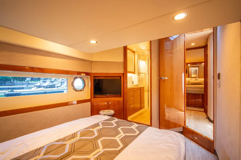 Slide: The Image of Luxurious interior of 2020 Riviera 525 SUV yacht bedroom with modern amenities. - 41