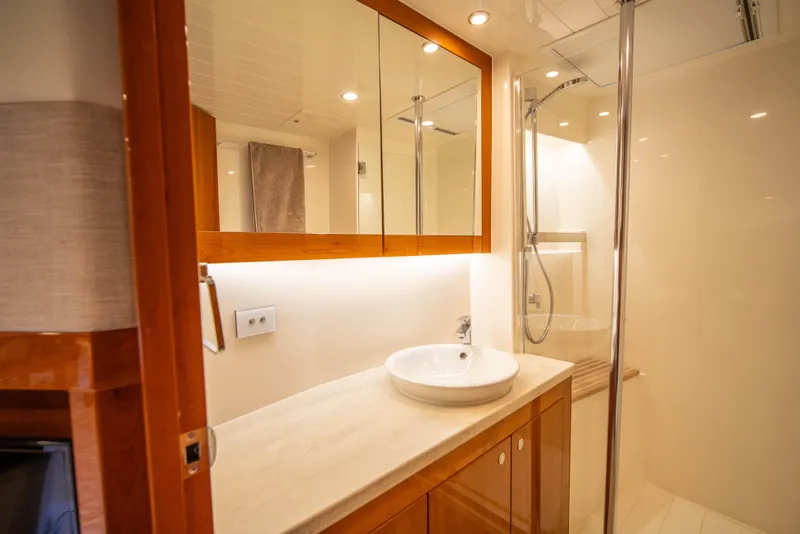 Slide: The Image of Luxurious bathroom in 2020 Riviera 525 SUV yacht with modern fixtures and elegant design. - 43
