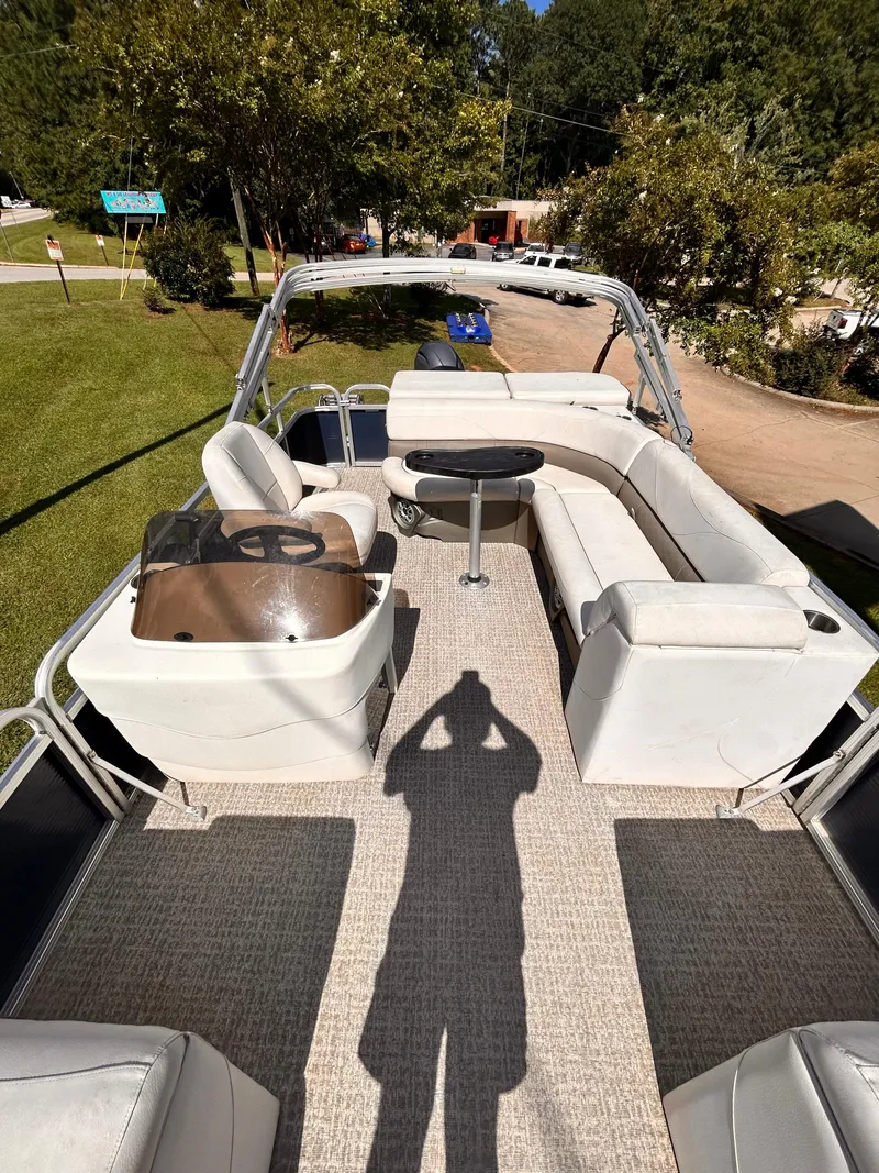 Slide: The Image of 2019 Avalon GS Cruise 25' pontoon boat with spacious seating and steering console. - 7