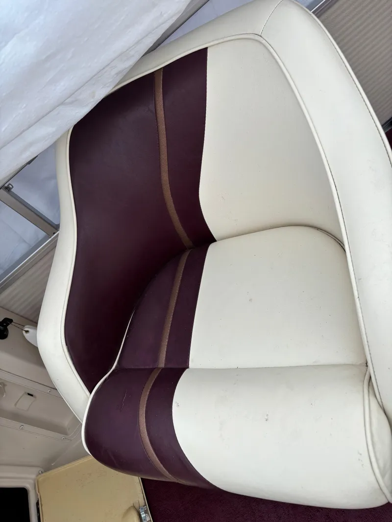 Slide: The Image of 1996 Premier ALANTE boat seat with maroon and white upholstery. - 17