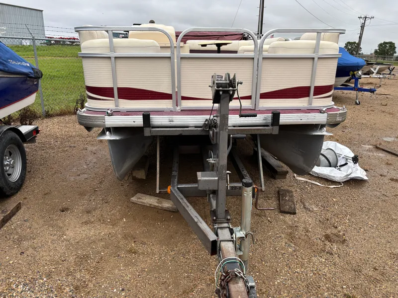 Slide: The Image of 1996 Premier ALANTE pontoon boat on trailer, parked outdoors on gravel. - 8