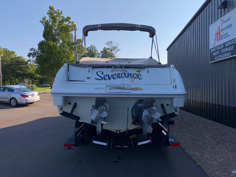 Slide: The Image of 2002 Formula 330 SS boat named "Severance" parked outside a storage facility. - 4
