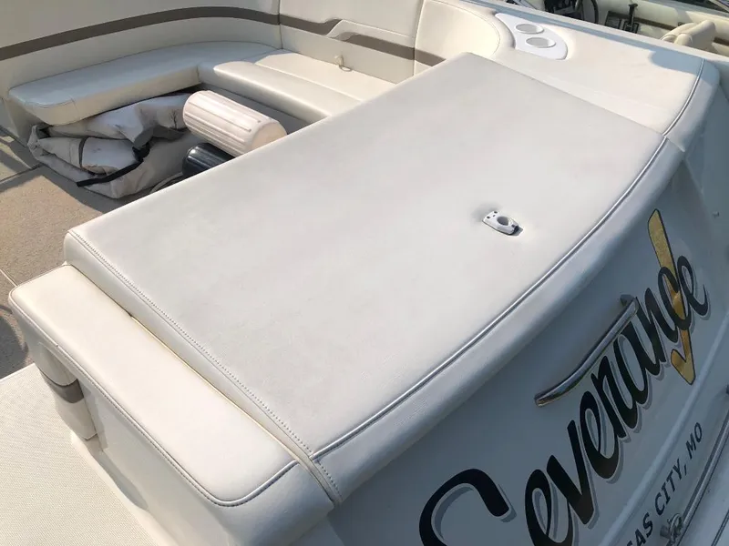 Slide: The Image of 2002 Formula 330 SS boat with cushioned seating and custom lettering. - 5