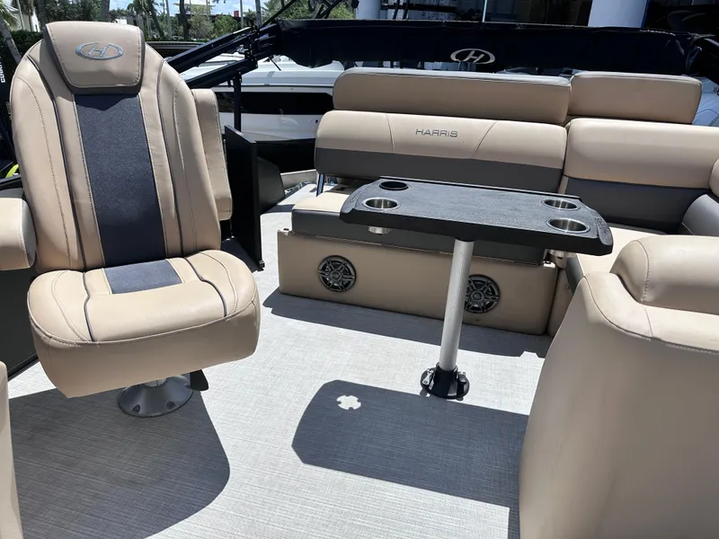 Slide: The Image of 2023 Harris Cruiser 230 interior with beige seating and a central table. - 17