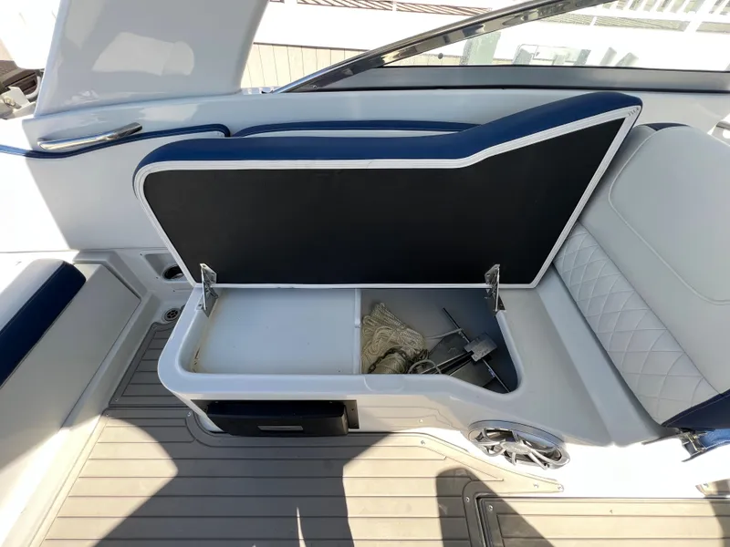 Slide: The Image of 2022 Crownline E305 XS Starboard Cockpit Seating Storage - 24
