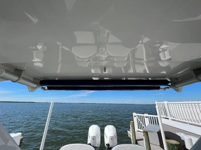 Slide: The Image of 2022 Crownline E305 XS Hardtop with Retracted SureShade - 27