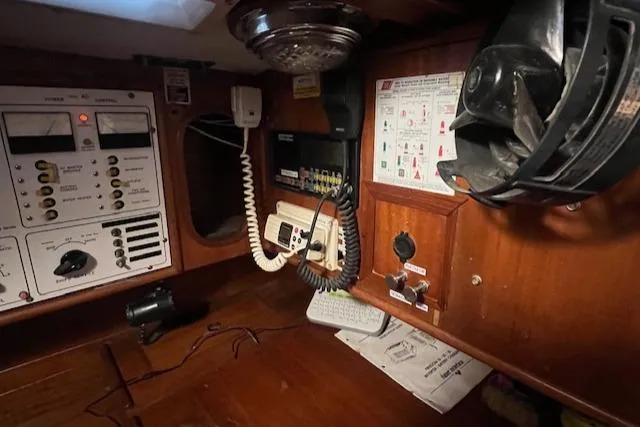 Slide: The Image of Navigation station of a 1984 Mason 43 Cutter sailboat with communication equipment. - 17