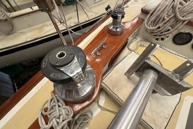 Slide: The Image of Deck of 1984 Mason 43 Cutter with winches and ropes. - 44
